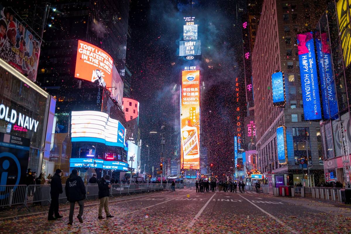 Confetti flies after the Times Square New Year's Eve Ball drops in a nearly empty Times Square, ...