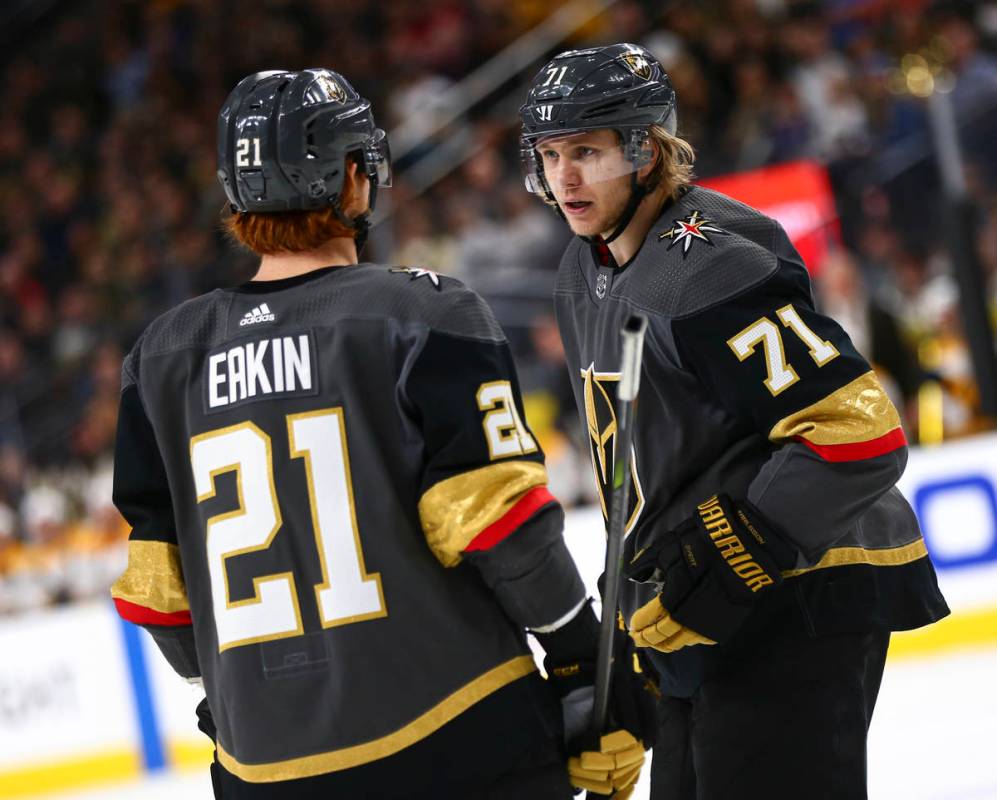 Golden Knights center William Karlsson (71) talks with Golden Knights center Cody Eakin (21) du ...