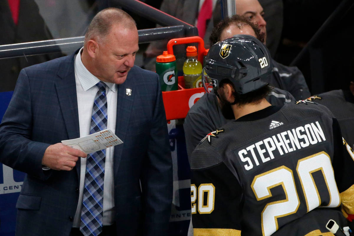 Vegas Golden Knights head coach Gerard Gallant talks to Vegas Golden Knights center Chandler St ...