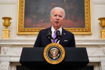 President Joe Biden speaks about the coronavirus in the State Dining Room of the White House, T ...