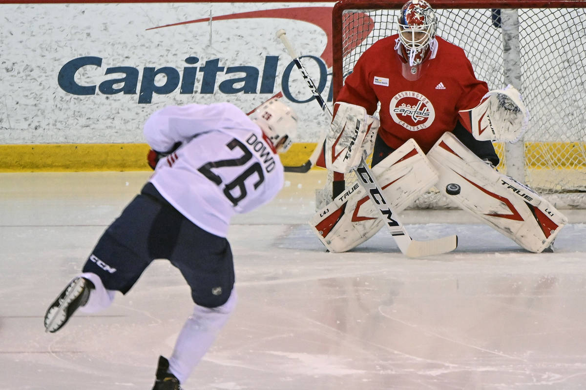 Washington Capitals center Nic Dowd (26) takes a shot on Capitals goaltender Ilya Samsonov duri ...