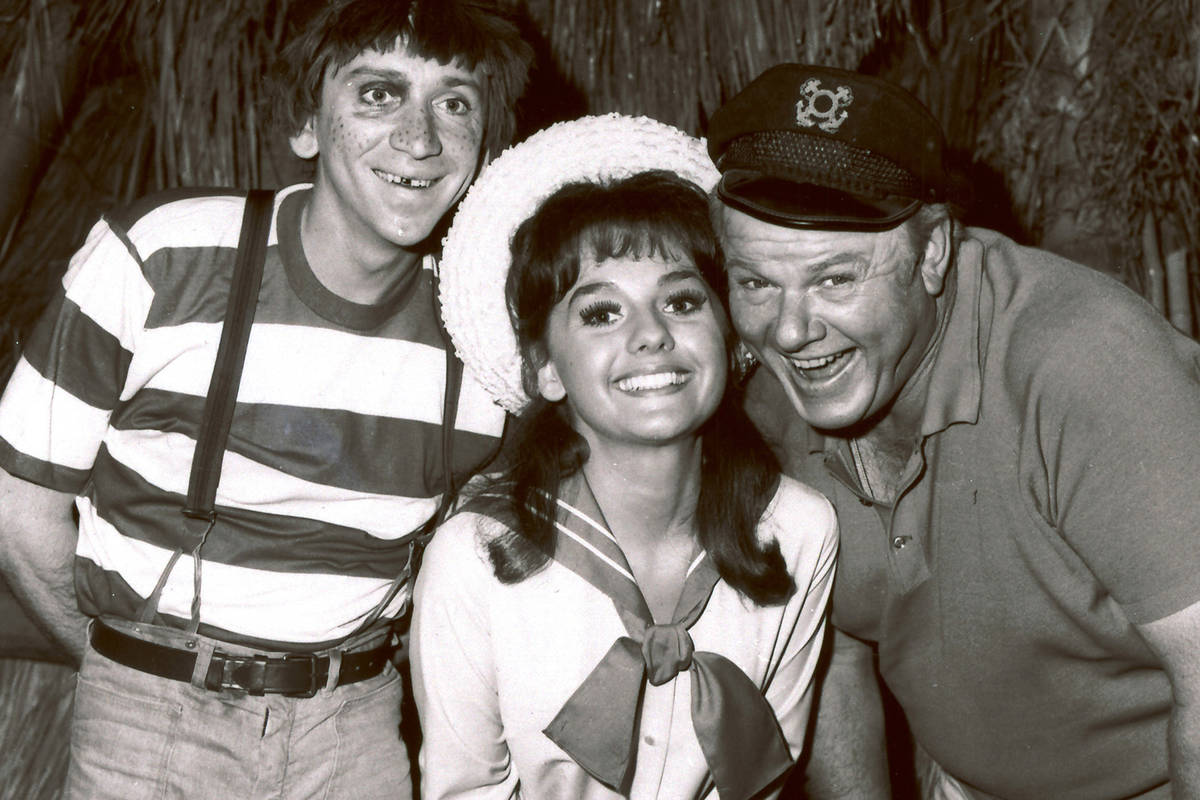 Dawn Wells, center, poses with fellow cast members of "Gilligan's Island," Bob Denver and Alan ...