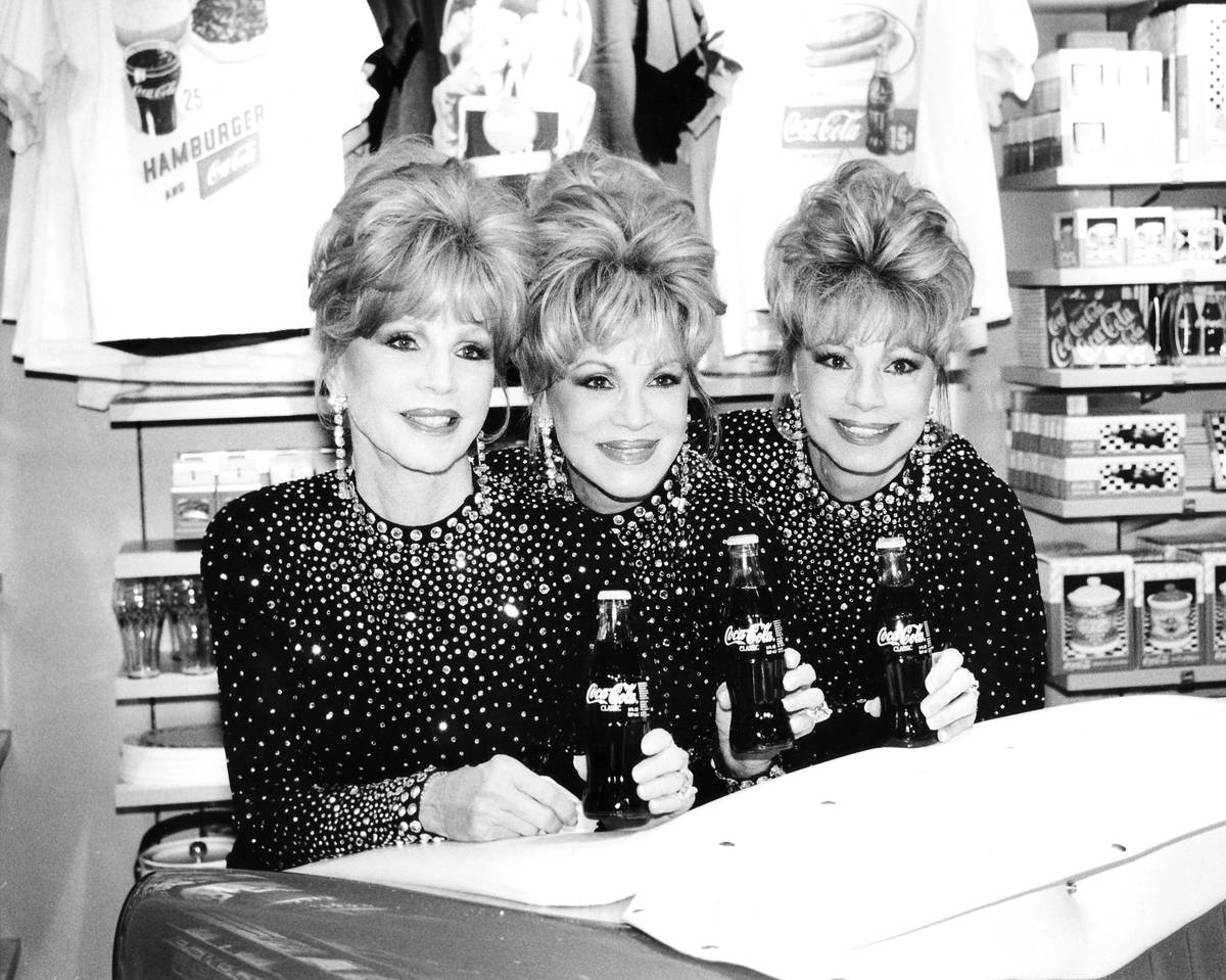 The McGuire Sisters, Christine, Phyllis and Dorothy are seen at the opening of the World of Coc ...