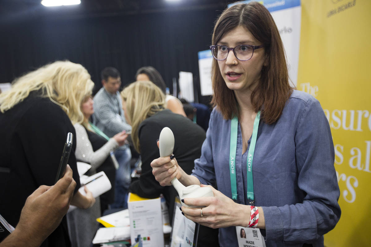 Mazie Houchens, engineering technician for Lora DiCarlo, a company that creates sex toys, holds ...