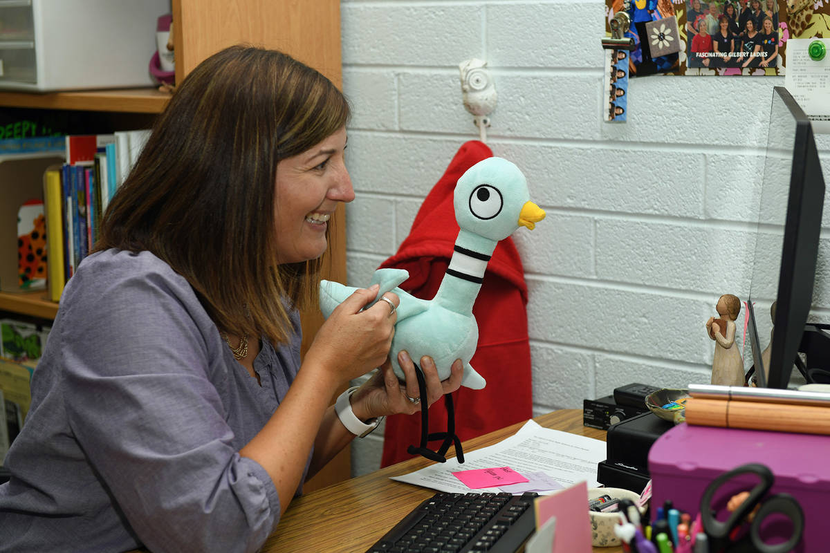 Wendy Payer juggles a busy schedule in the library at the Gilbert Academy of Creative Arts in N ...