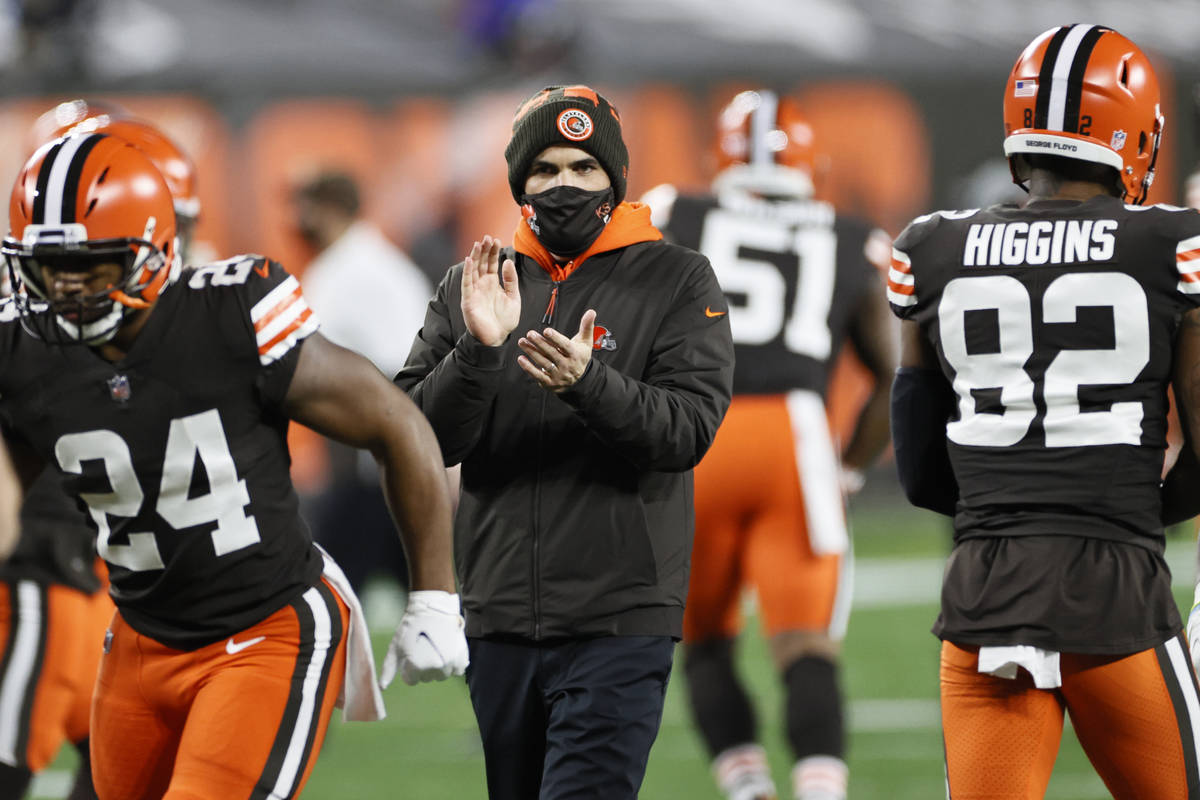 Cleveland Browns head coach Kevin Stefanski keeps watch before an NFL football game against the ...