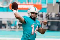 Miami Dolphins quarterback Ryan Fitzpatrick (14) warms up before an NFL football game against t ...