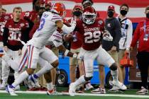 Florida defensive back Donovan Stiner attempts to stop Oklahoma running back Rhamondre Stevenso ...