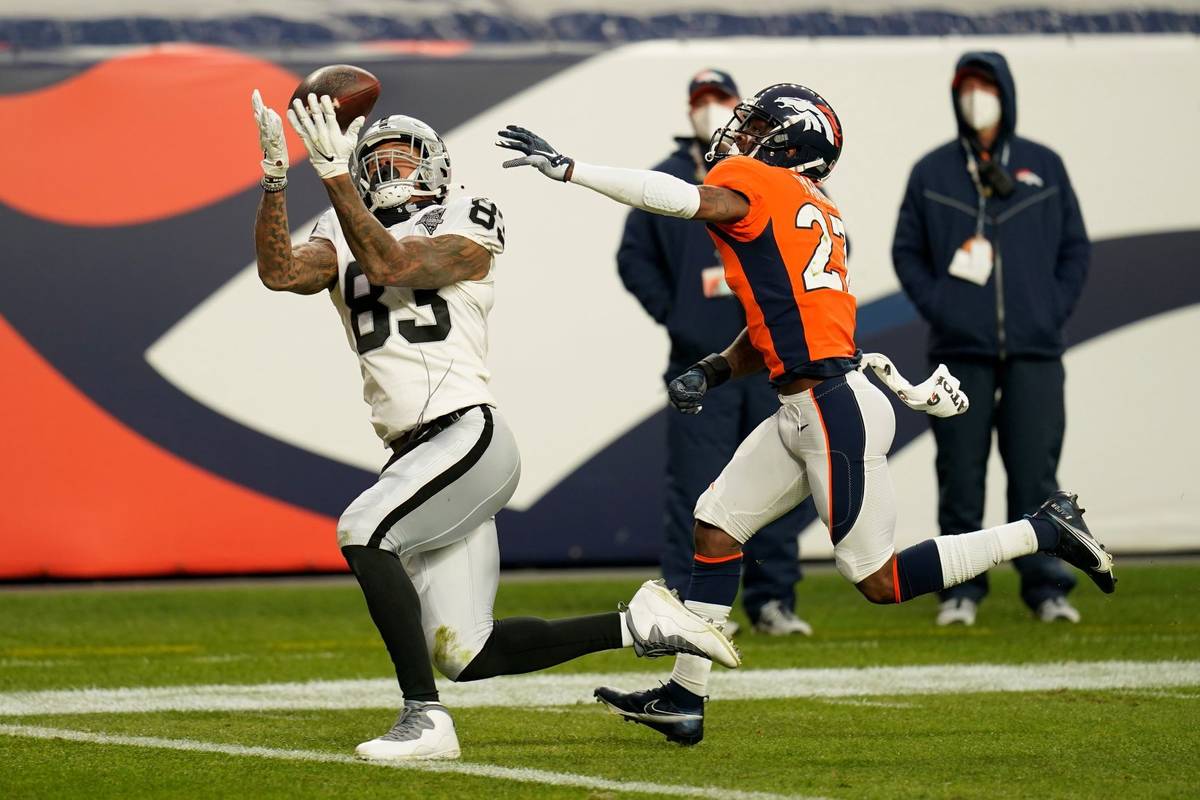 Las Vegas Raiders tight end Darren Waller (83) catches a touchdown pass against Denver Broncos ...