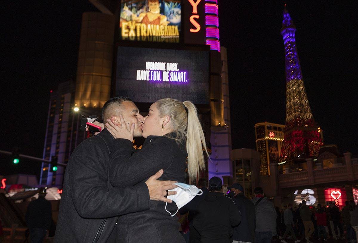 Jose Badillo, 37, left, and Bella Lamos, 27, of of San Jose, Calif., kiss on Las Vegas Blvd., w ...