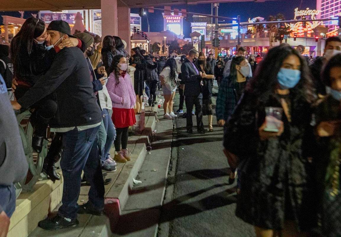 Individuals gather to celebrate New Years Eve on the Las Vegas Strip on Thursday, Dec. 31, 2020 ...