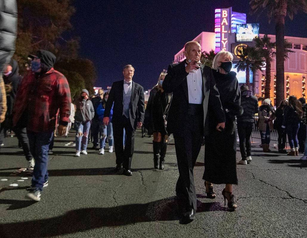 Individuals gather to celebrate New Years Eve on the Las Vegas Strip on Thursday, Dec. 31, 2020 ...
