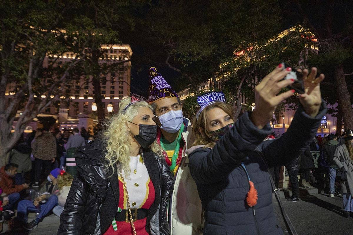 Karmella and Edmond Varpanin, left, and Stella Khania take a photograph while celebrating New Y ...
