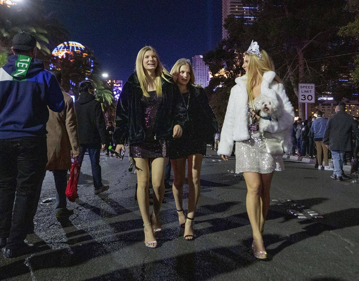 Sadie, 13, left, Makenzie, 15, center and their mom Holly Gallup, 45, of San Jose, Calif., walk ...