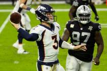 Las Vegas Raiders defensive tackle Maliek Collins (97) puts pressure on Denver Broncos quarterb ...