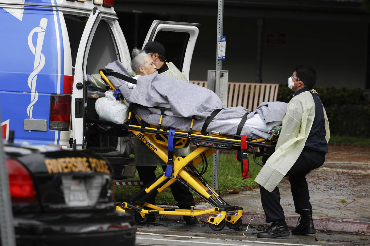 FILE - This April 8, 2020, file photo shows a patient being evacuated from the Magnolia Rehabil ...