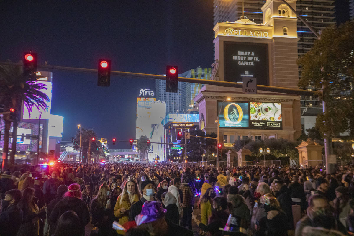 Individuals gather to celebrate New Years Eve on the Las Vegas Strip, Thursday, Dec. 31, 2020. ...