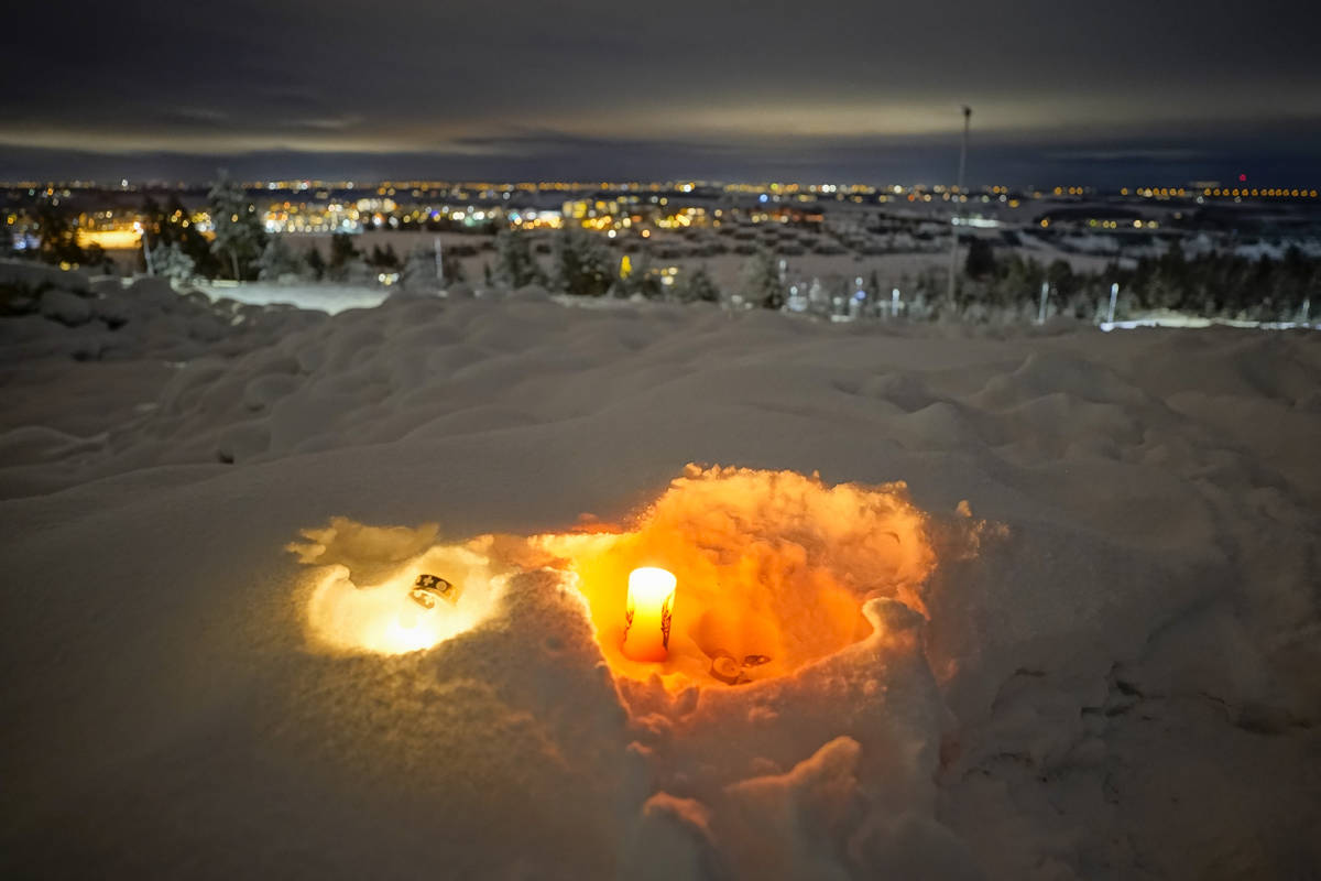 A candle burns on Saturday Jan. 2, 2021, for the victims of the massive landslide that hit the ...