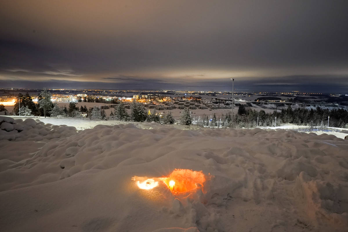 A candle burns on Saturday Jan. 2, 2021, for the victims of the massive landslide that hit the ...
