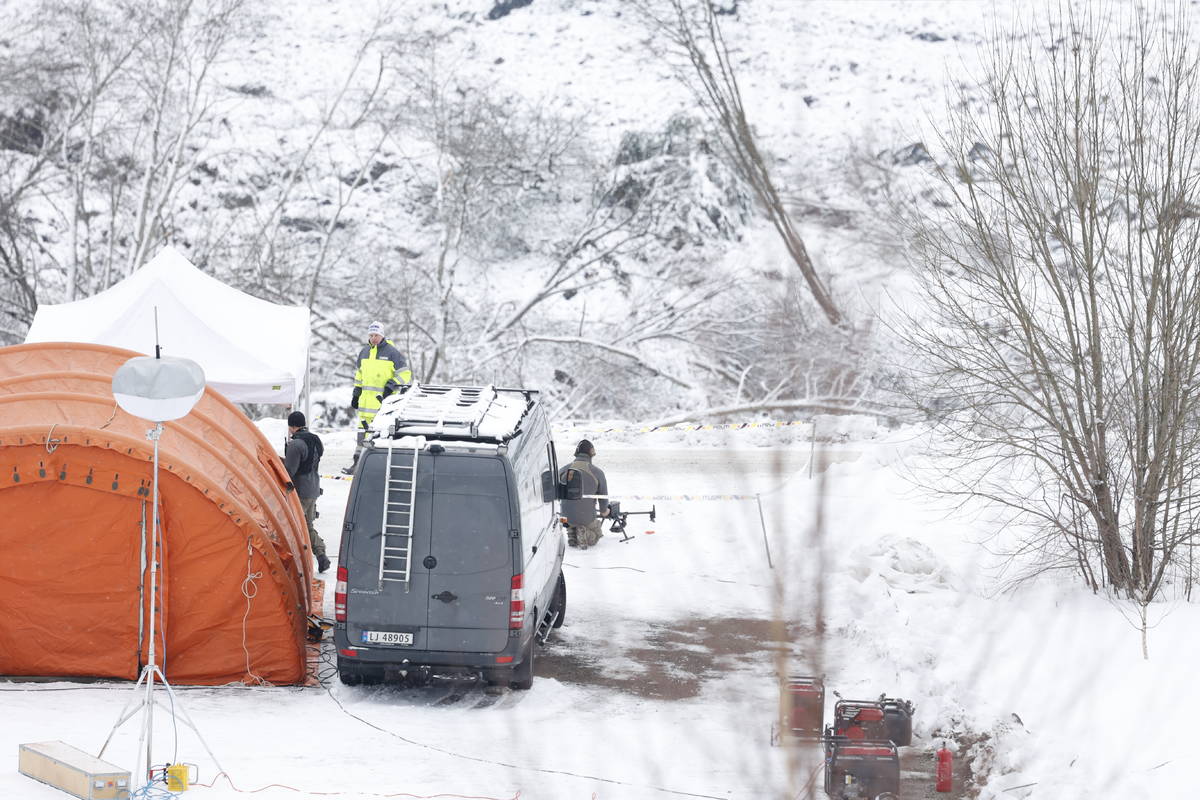 Rescue crews work in the area at Ask in Gjerdrum, Saturday Jan. 2, 2021, after a massive landsl ...