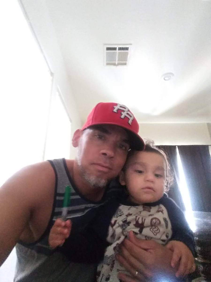Eric Echevarria poses with his grandson in an undated photo. The 52-year-old was killed Wednesd ...