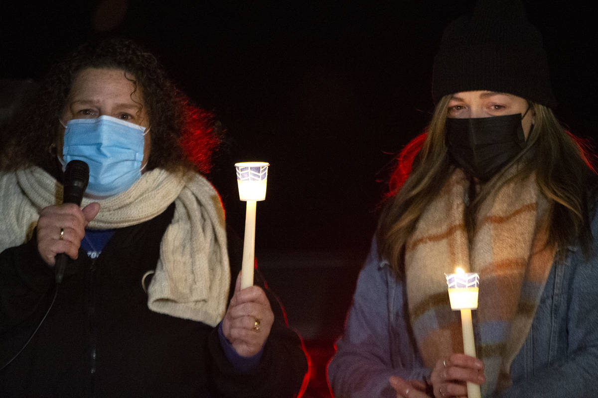 Annmarie Echevarria, left, and Ashley Robledo speak at a vigil for Eric Echevarria, their husba ...