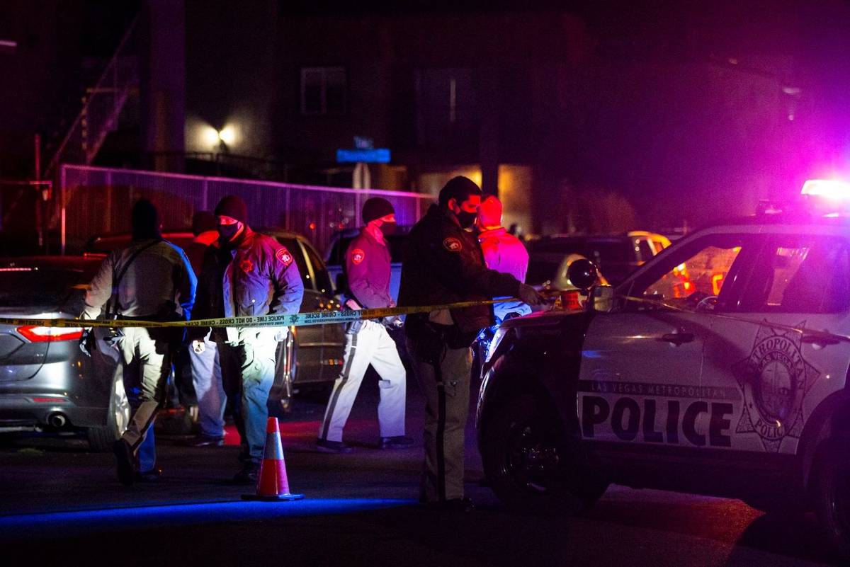 Las Vegas police respond to the scene of a homicide on Dunsbach Way, near East Lake Mead Boulev ...