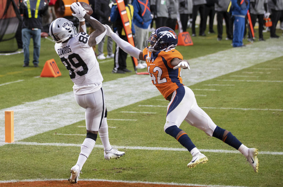Raiders wide receiver Bryan Edwards (89) catches a touchdown pass over Denver Broncos cornerbac ...