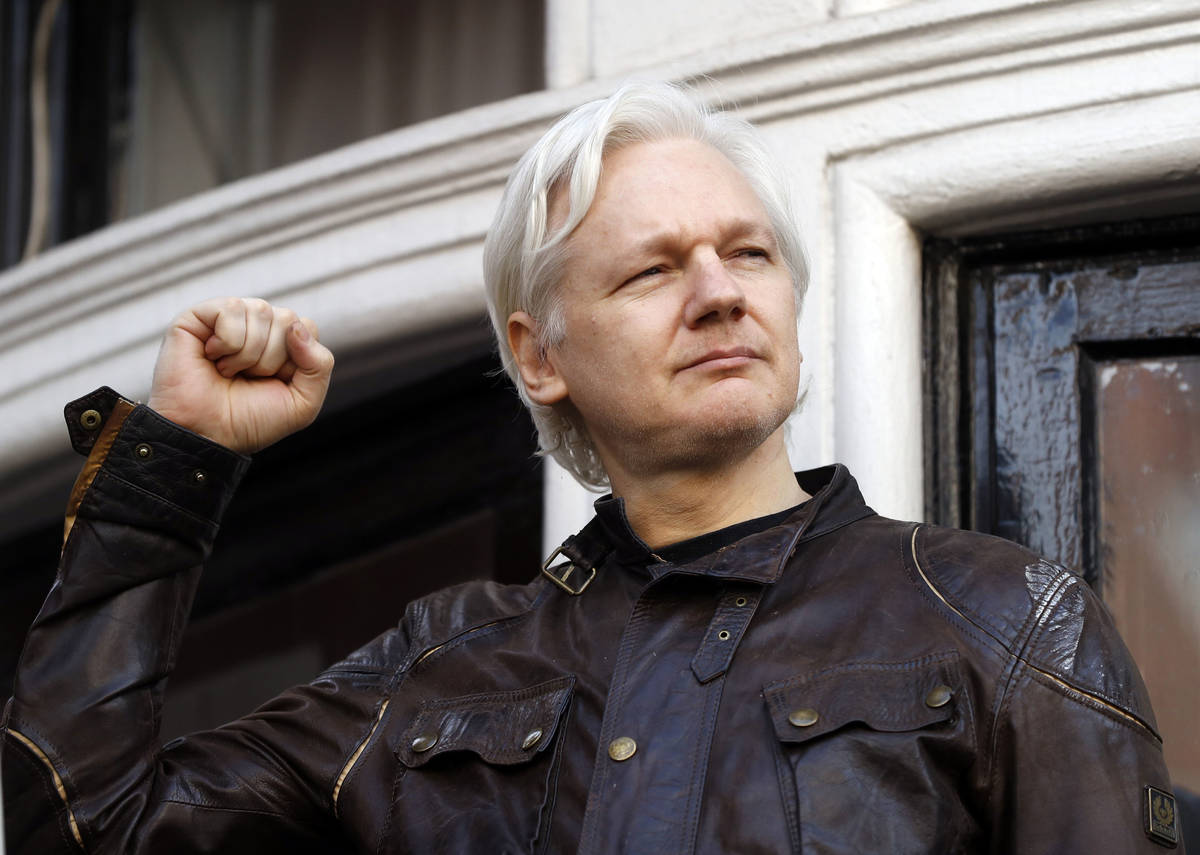 In a May 19, 2017, file photo, WikiLeaks founder Julian Assange greets supporters outside the E ...