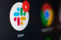 This Dec. 2, 2020, file photo shows the Slack app icon being displayed on a computer screen in ...