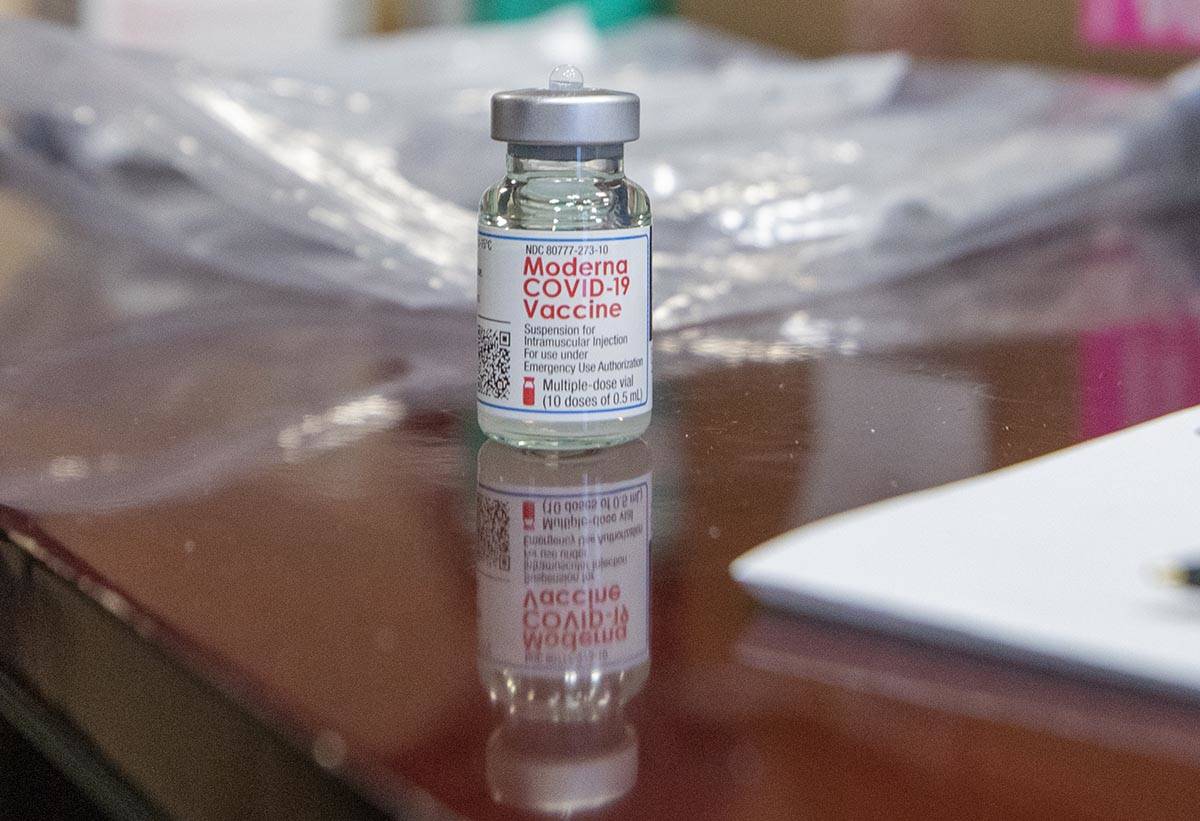 The North Las Vegas Fire Department administers its first batch of a COVID-19 vaccines to first ...