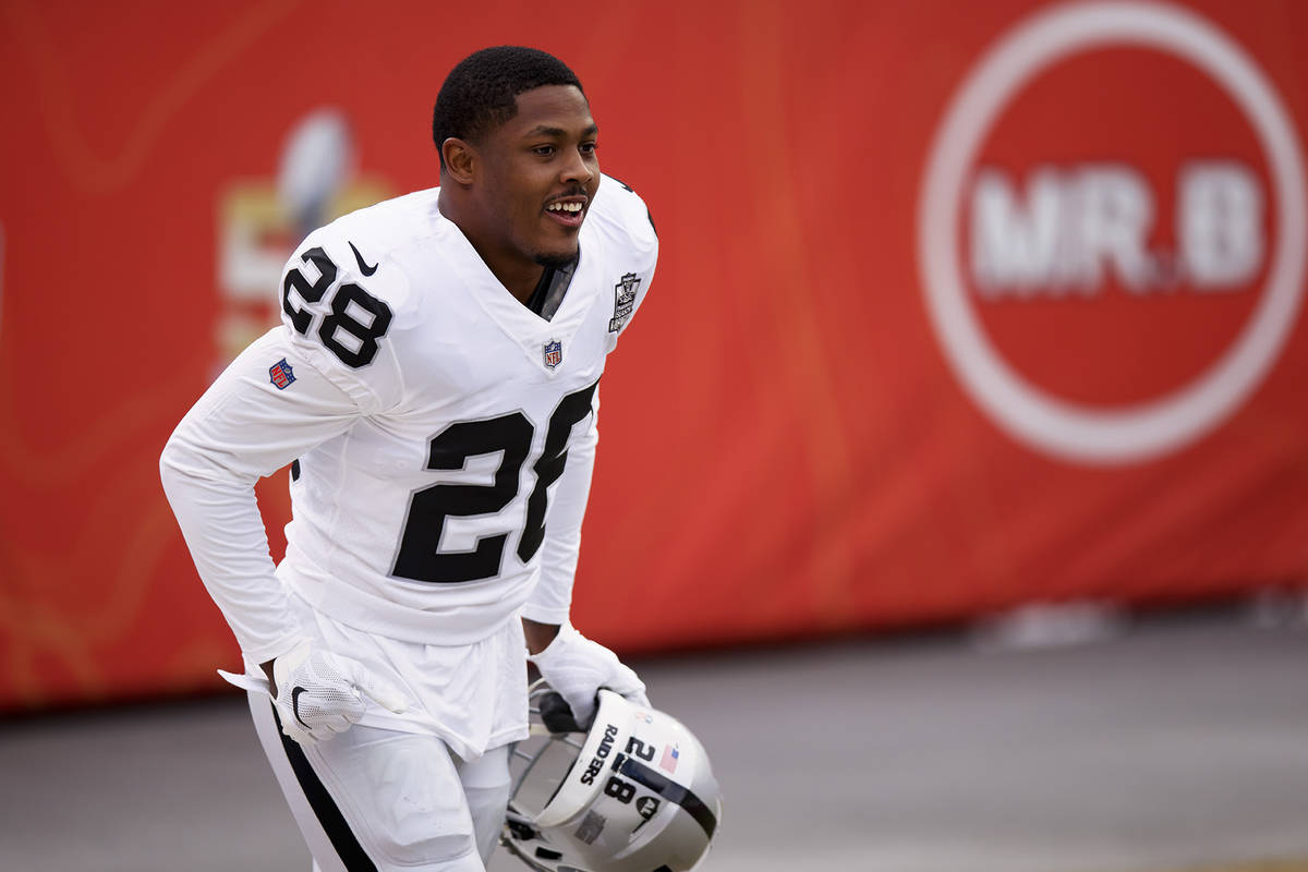 Las Vegas Raiders running back Josh Jacobs (28) takes the field against the Denver Broncos befo ...