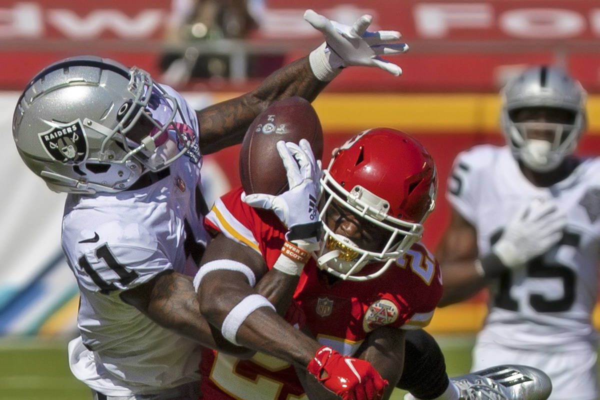 Raiders wide receiver Henry Ruggs III (11) pulls in an acrobatic catch over Kansas City Chiefs ...