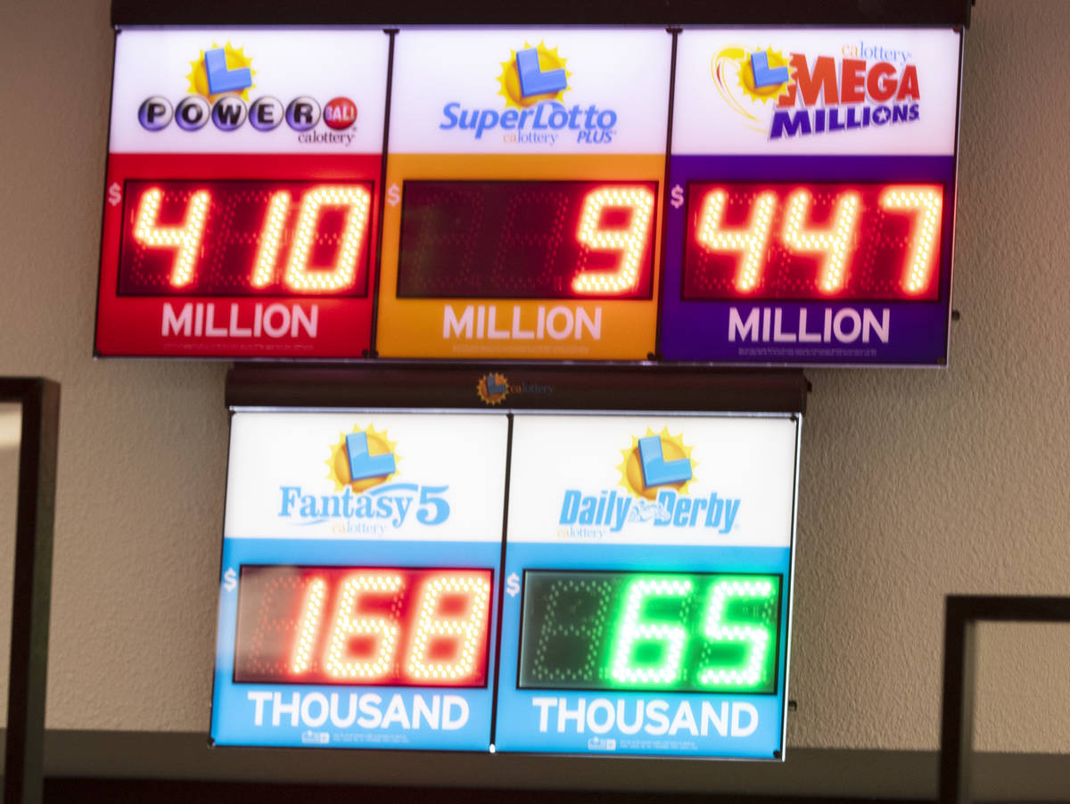 A Mega Millions and Powerball sign at The Lotto Store at Primm shows the current jackpots on Tu ...