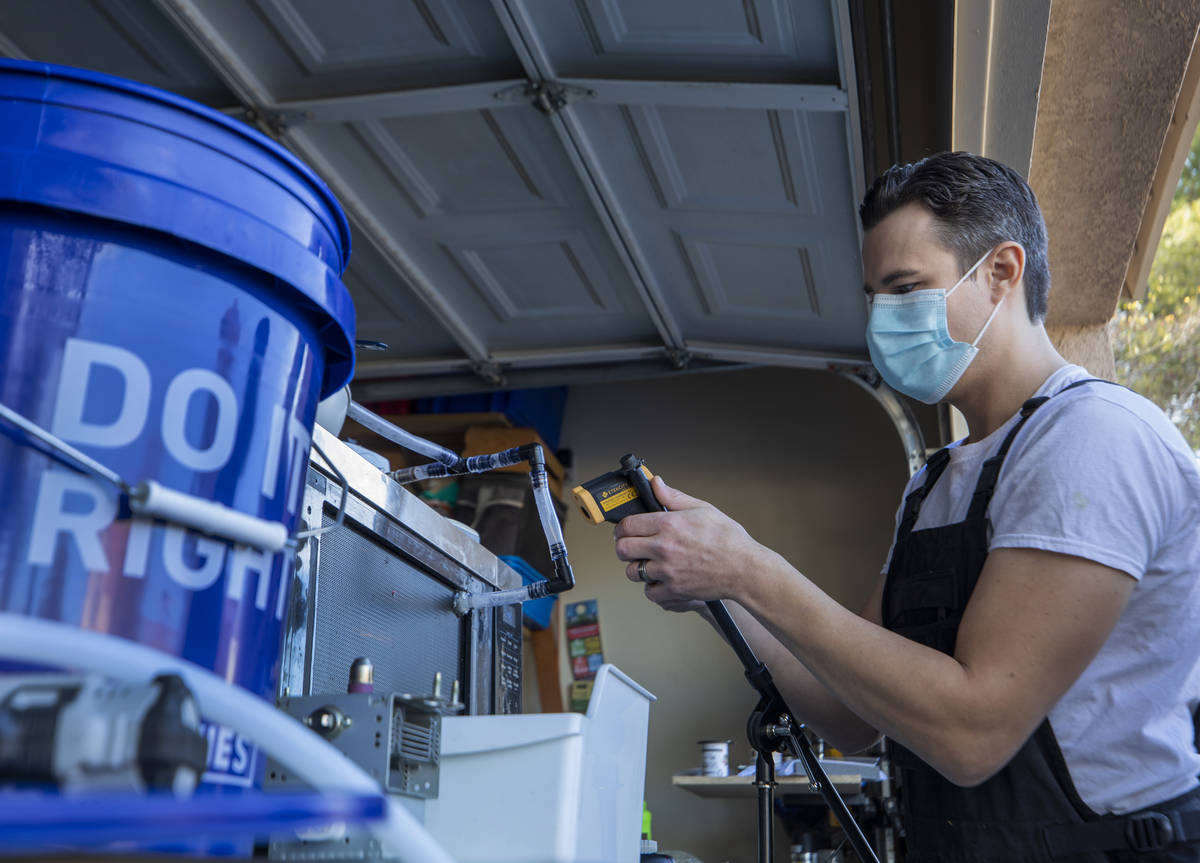 UNLV graduate Scott Isler, 33, works on "Microwave for COVID-19 Disinfection," at Isl ...