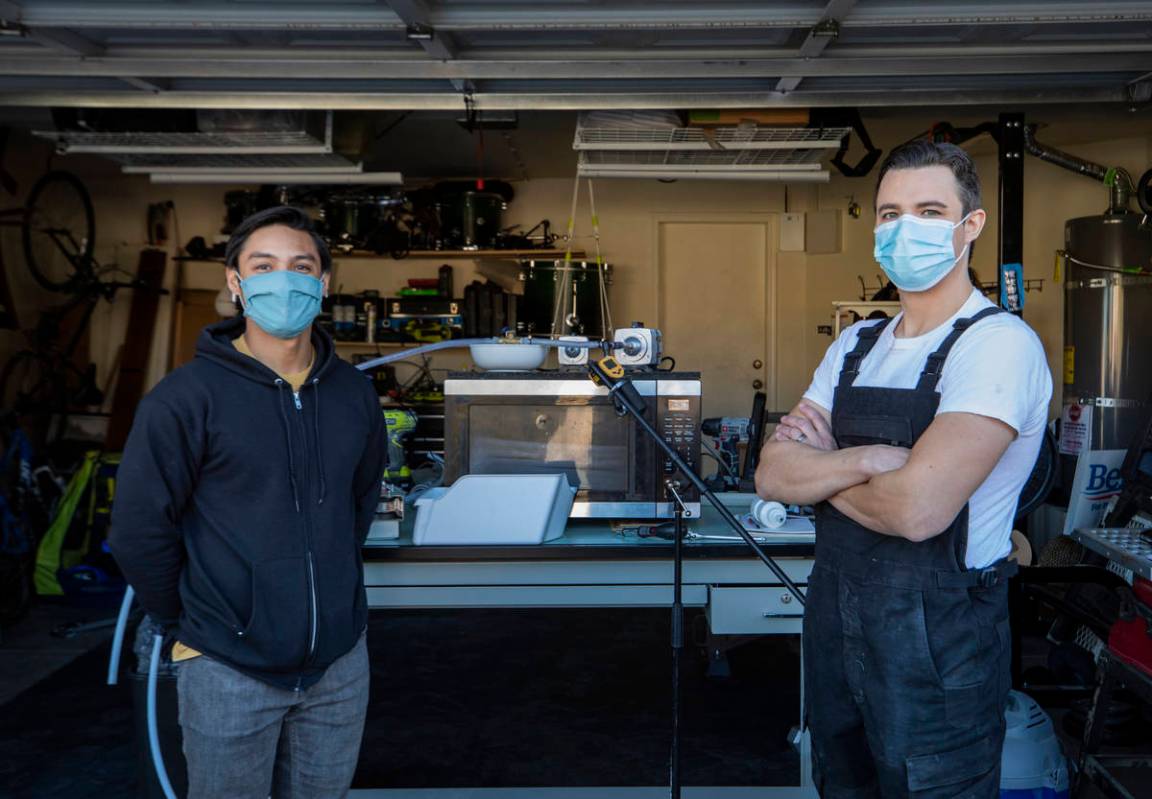 UNLV graduates Jeffrey Topacio, 32, left, and Scott Isler, 33, is photographed with their proje ...