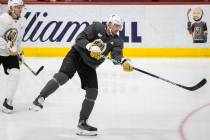Golden Knights defenseman Shea Theodore (27) shoots on goal during practice at City National Ar ...