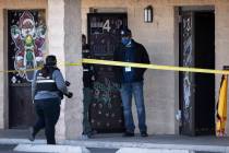 North Las Vegas police investigators work the scene of a fatal shooting near the intersection o ...