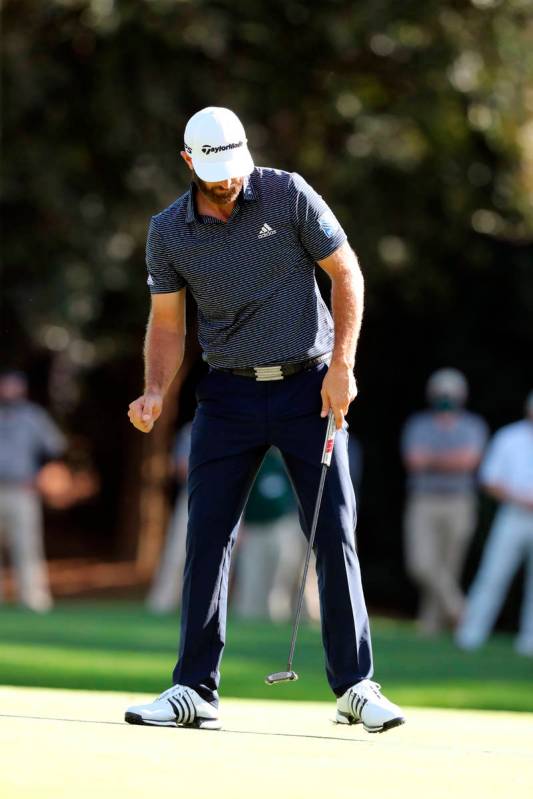 Dustin Johnson reacts after making a birdie on the 15th hole during the final round of the Mast ...