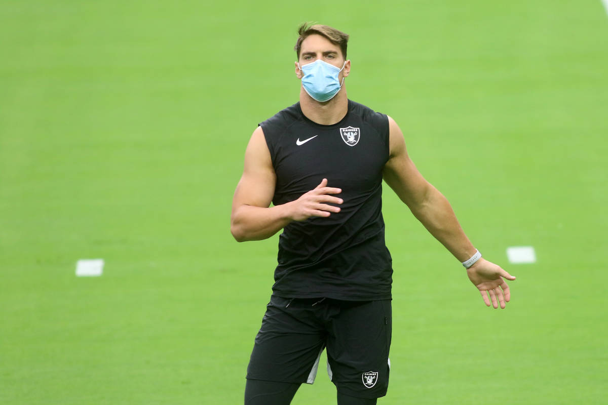 Las Vegas Raiders linebacker Tanner Muse warms up prior to a team practice at Allegiant Stadium ...