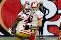 San Francisco 49ers running back Jeff Wilson (30) celebrates his touchdown with quarterback C.J ...