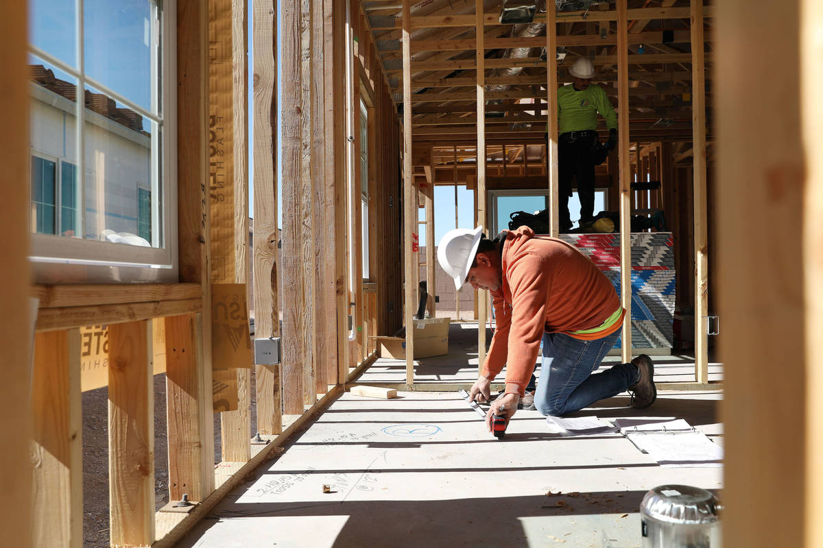 Supervisor Antonio Mondrago works on electricity plans on StoryBook home development in Cadence ...