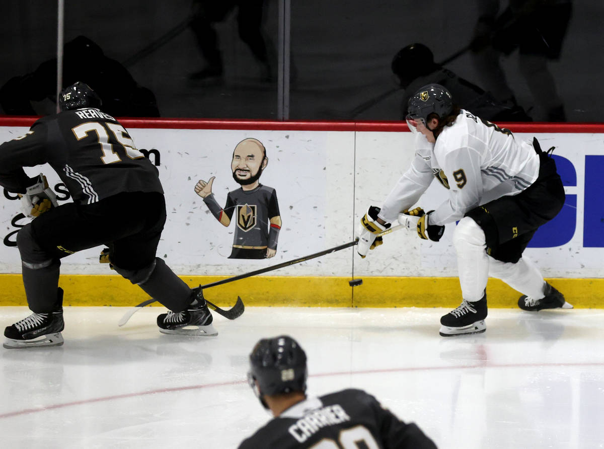 Golden Knights center Cody Glass (9) battles for the puck with right wing Ryan Reaves (75) duri ...
