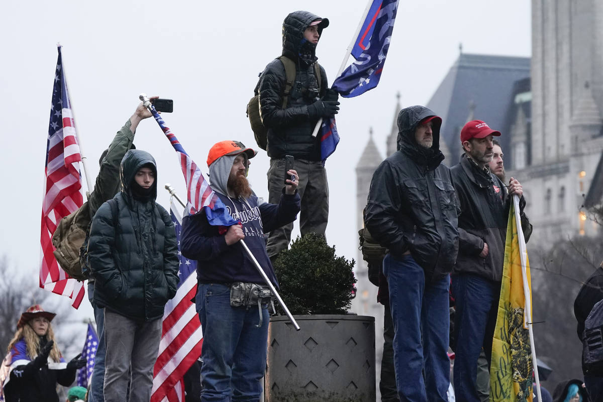 People attend a rally at Freedom Plaza Tuesday, Jan. 5, 2021, in Washington, in support of Pres ...