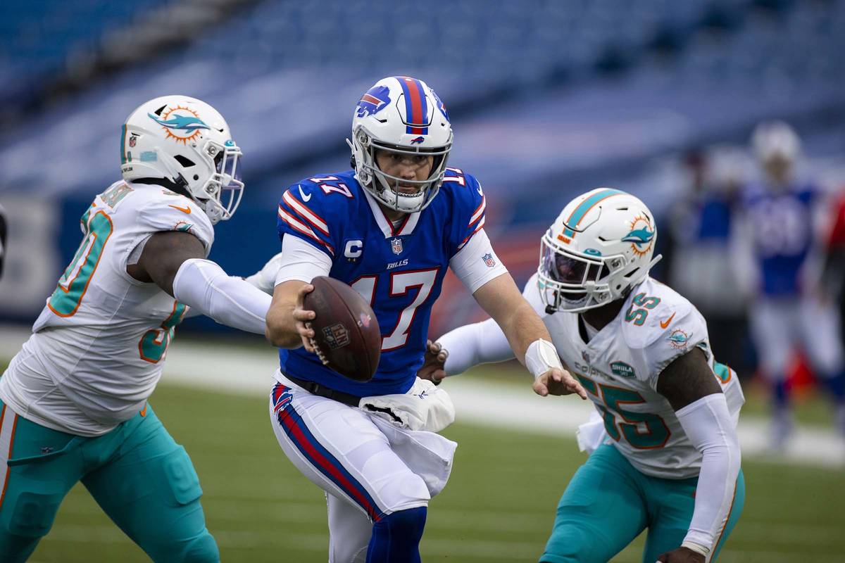 Buffalo Bills quarterback Josh Allen (17) runs with the ball during the second quarter of an NF ...