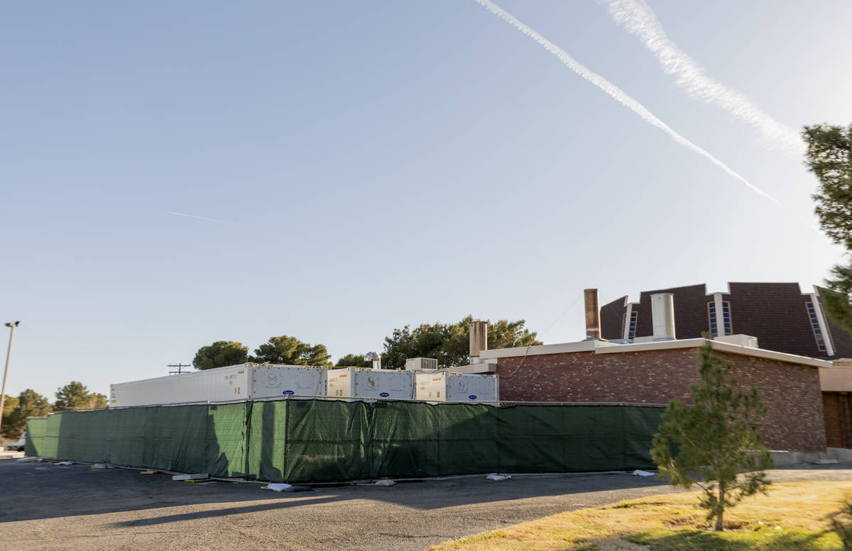 Three large refrigerated units are pictured on Tuesday, Jan. 5, 2021, outside the Davis Funeral ...