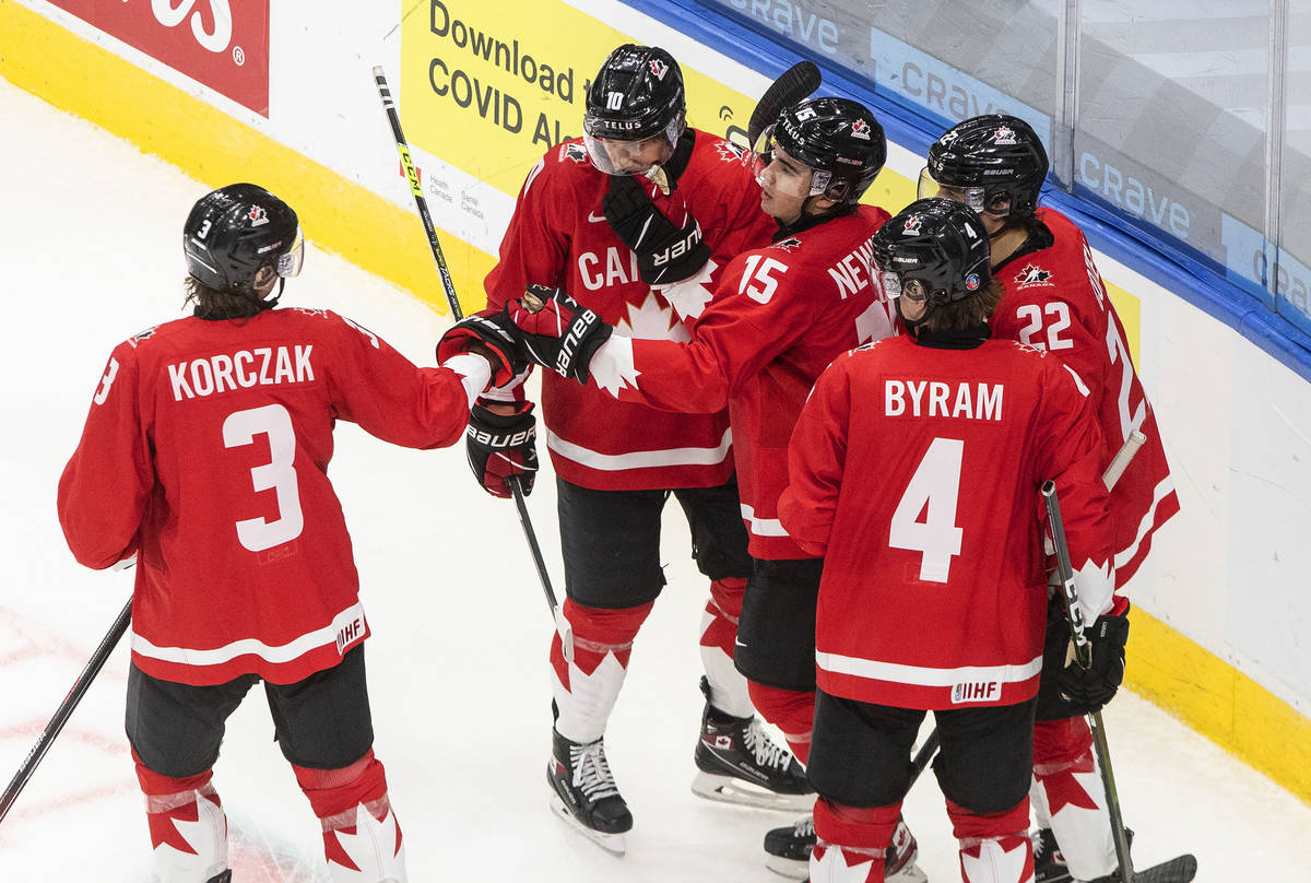 Canada's Kaedan Korczak (3), Dylan Holloway (10), Alex Newhook (15), Dylan Cozens (22) and Bowe ...