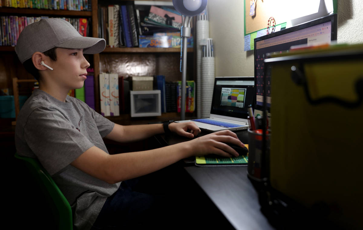Zacchery Zrebiec, 14, a freshmen at Southeast Career Technical Academy, during distance learnin ...