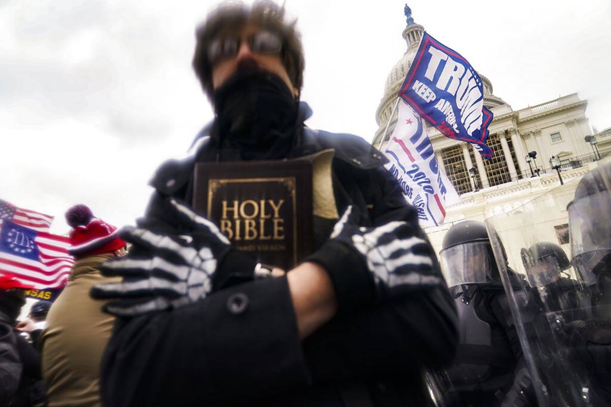 Trump supporters gather outside the Capitol, Wednesday, Jan. 6, 2021, in Washington. (AP Photo/ ...