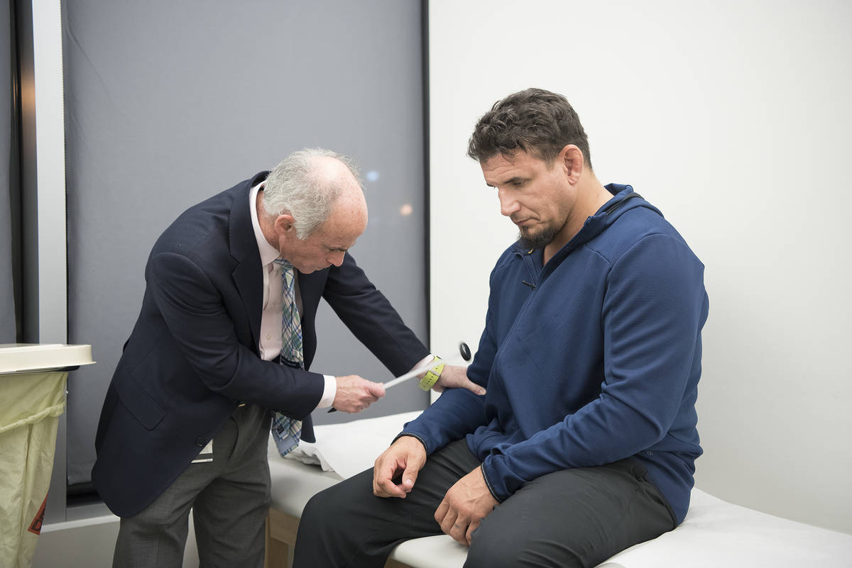 Dr. Charles Bernick conducts a neurological evaluation on a PABHS participant before the COVID- ...